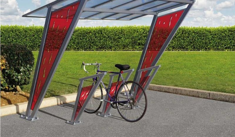 Cette image est une photographie d'un ensemble abris et arceaux vélo. Elle illustre l'ensemble des infrastructures vélo et mobilier urbain de vélo que Nathis peut fournir et installer aux entreprises et collectivités de Bretagne.